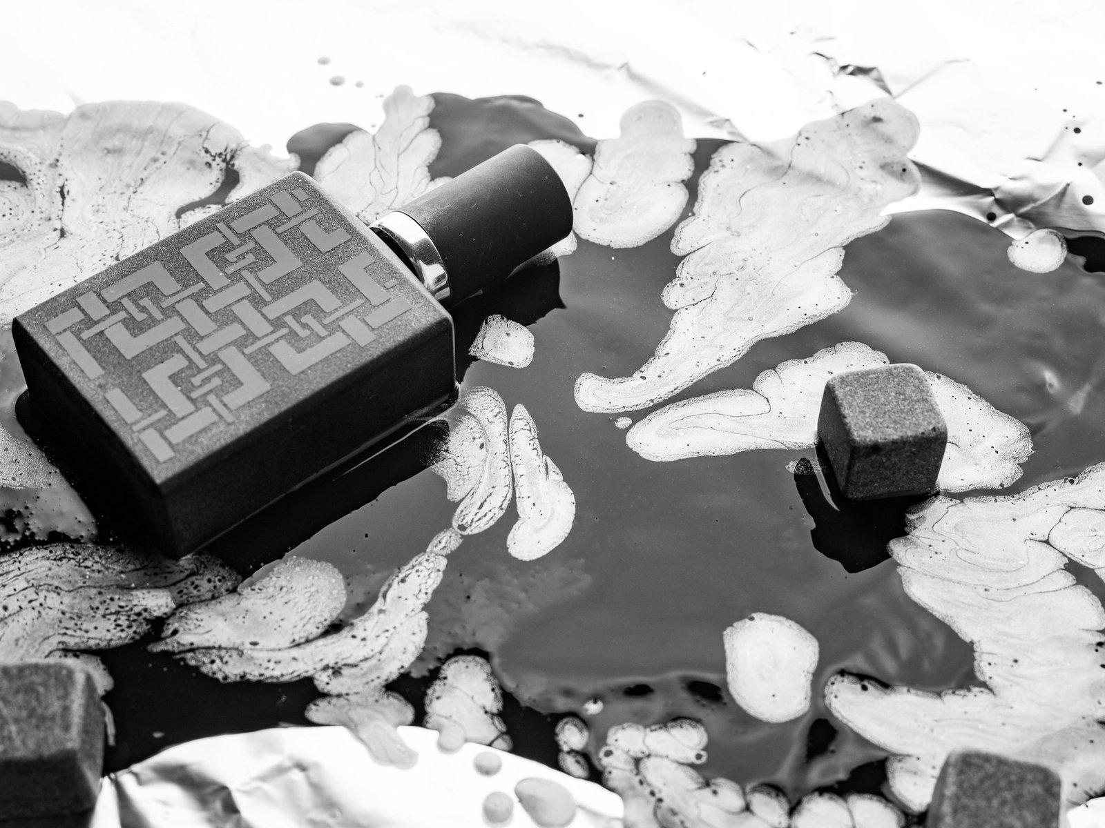 Perfume bottle on dark elegant surface